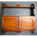 AN ANTIQUE WOODEN HANGING SHELF WITH TWO CUPBOARD DOORS, carved with shell decoration. 62 cm x 60 c