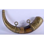 AN 18TH CENTURY MIDDLE EASTERN ISLAMIC CARVED POWDER HORN decorated with foliage and motifs. 33 cm