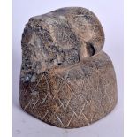 A RARE BACTRIAN STONE IDOL, formed with a geometric carved body. 10 cm x 9.5 cm.