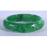 A CHINESE SPINACH JADE BANGLE 20th Century. 7 cm wide.