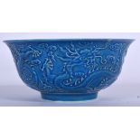 A CHINESE BLUE GLAZED MONOCHROME PORCELAIN BOWL BEARING QIANLONG MARKS, decorated in relief with d