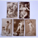 FIVE VINTAGE EROTIC POSTCARDS depicting females in various pursuits. (5)