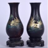 A PAIR OF EARLY 20TH CENTURY CHINESE BLACK LACQUER VASE ON STAND, painted with landscape scenery. 1