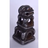 A CHINESE SILVERED BRONZE SEAL, the terminal in the form of a foo dog. 4 cm high.