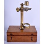 A VERY RARE VICTORIAN TRAVELLING BRASS FIELD MICROSCOPE within a fitted case. (2)