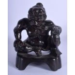 A 19TH CENTURY JAPANESE MEIJI PERIOD BRONZE FIGURE OF A MUSCULAR BUDDHA. 17 cm x 10 cm.