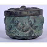 AN ISLAMIC COPPER BOX AND COVER, decorated in relief with floral inspired cover. 7 cm x 10 cm.