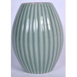 A CHINESE CELADON GLAZED PORCELAIN VASE BEARING QIANLONG MARKS, barrel shaped and formed with a rib