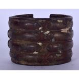 A WEST AFRICAN BRONZE BANGLE, decorated with geometric motifs. 6 cm x 8 cm.