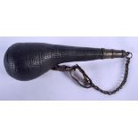 AN ANTIQUE LEATHER MOUNTED POWDER FLASK. 24 cm long.