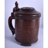 AN 18TH CENTURY SCANDINAVIAN TREEN CARVED BIRCH TANKARD carved with a stylised lion. 24 cm x 14 cm.