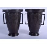 A PAIR OF 19TH CENTURY CHINESE TWIN HANDLED BRONZE VASES. 23 cm x 15 cm.