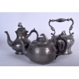 AN ANTIQUE SILVER PLATED TEA POT, together with two pewter tea pots. Largest 24 cm x 22 cm.