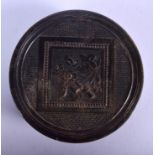 A REGENCY CARVED PRESSED HORN AND TORTOISESHELL SNUFF BOX. 7.5 cm diameter.