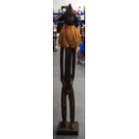 A LARGE MALIAN BAMBARA TRIBAL WOODEN FIGURE, formed standing with a ruffle around neck. 122 cm high