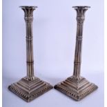 A PAIR OF GEORGE III SILVER CANDLESTICKS. London 1759. 40.7 oz inc wood base. 32 cm high.