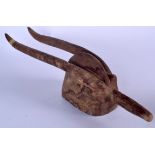 A MALIAN BAMBARA WOODEN MASK, in the form a mythical bird. 64 cm long.