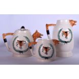 A FOX HEAD POTTERY TEA POT, together with a milk jug and another. Largest 21 cm high. (3)