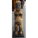 A LARGE CAMEROON BAMILEKE CARVED WOODEN TRIBAL FIGURE, formed with a beadwork face and extensive sh