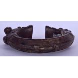 AN IVORY COAST BAOULE BRONZE BANGLE, formed with rope twist decoration. 9 cm wide.