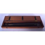 AN ANTIQUE ROLLING RULER, in mahogany case. 49 cm wide.