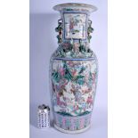A LARGE 19TH CENTURY CHINESE CANTON FAMILLE ROSE VASE Qing, painted with figures within landscapes.