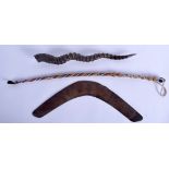 AN AFRICAN BEADWORK TRIBAL WHIP together with a boomerang & a carved horn. (3)
