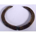 A RARE LATE BRONZE AGE PENDANT, in the form of opposing boar tusks. 12.5 cm wide.