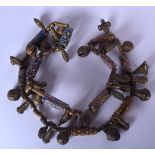 AN AFRICAN BRONZE AND GLASS NECKLACE, formed with varied decorative items including bells. 84 cm lo