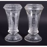 A PAIR OF 19TH CENTURY VENETIAN CLEAR GLASSES etched with figures and buildings. 12.5 cm high.