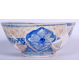 A PERSIAN POTTERY BOWL, decorated with birds and foliage. 22 cm wide.