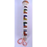 A SOUTH AFRICAN ZULU BEADWORK SCEPTRE, formed with staggered coloured decoration. 29 cm long.