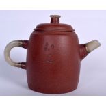 A CHINESE YIXING POTTERY TEA POT WITH JADE FITTINGS, incised with calligraphy. 14.5 cm wide.