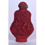 A CHINESE CARVED CINNABAR LACQUER SNUFF BOTTLE, depicting birds amongst foliage. 7.5 cm high.