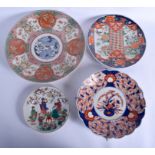 THREE 19TH CENTURY JAPANESE MEIJI PERIOD IMARI CHARGERS together with a plate. Largest 34 cm wide.