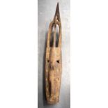 A LARGE AFRICAN CARVED TRIBAL MASK, formed as a crocodile type creature. 121 cm long.