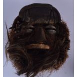 A LIBERIAN WOODEN TRIBAL HORROR MASK, formed with an open mouth. 40 cm x 35 cm.