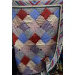 AN ANTIQUE PATCHWORK QUILT. 220 cm x 160 cm.