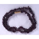 A CHINESE CARVED AMETHYST NECKLACE, formed with naturalistic beads. 42 cm long.