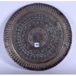 A 17TH CENTURY SAFAVID TINNED COPPER PLATE Persia, decorated with foliage. 19 cm wide.