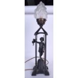 A METAL LAMP IN THE FORM OF A STANDING BOY, formed with a glass flame shade. 66 cm high.