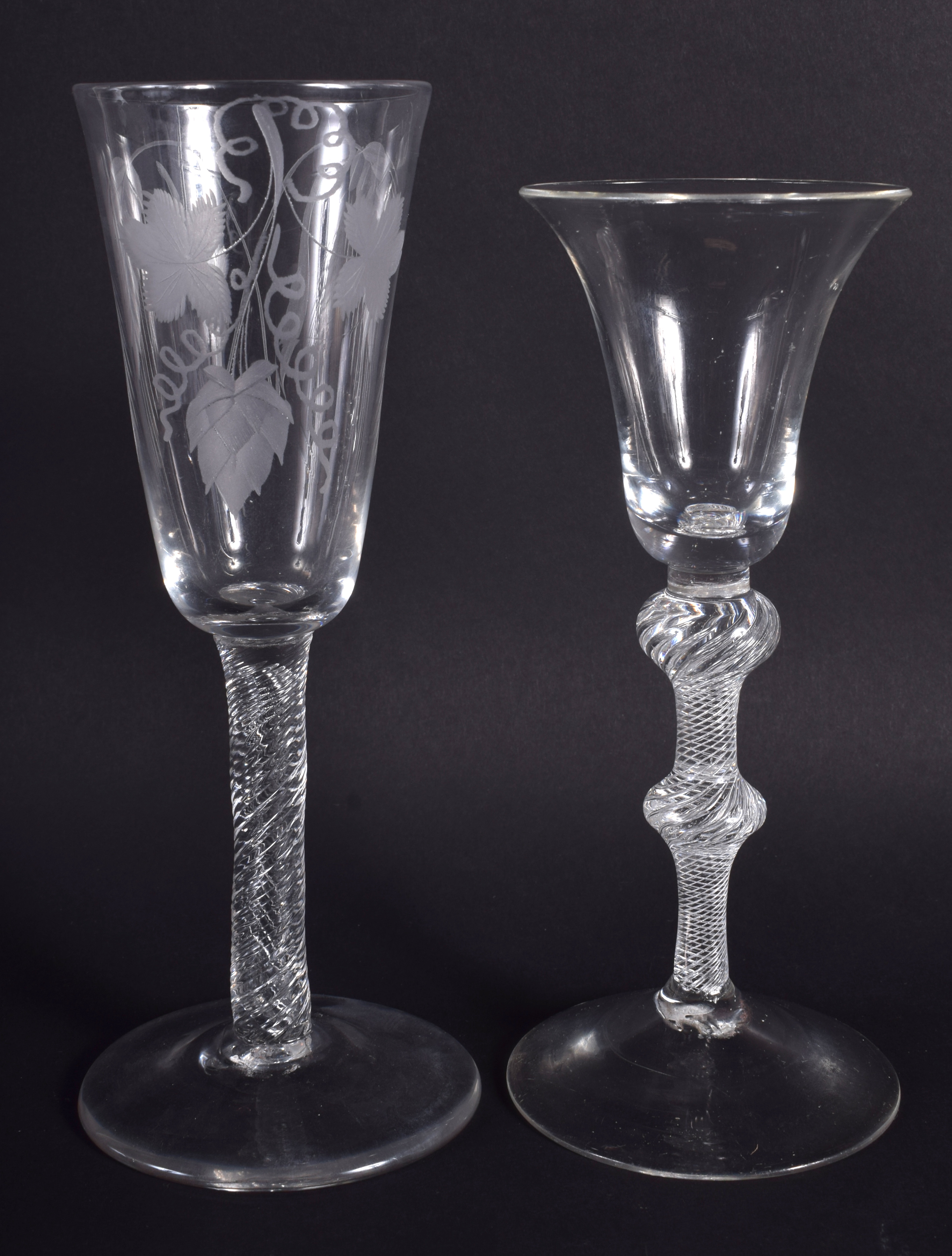 TWO EDWARDIAN GEORGE III STYLE GLASSES. 18 cm & 17 cm high. (2)