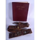 A 1950S SOUTH AFRICA MARITIME SHIPS DIARY together with a vintage military belt decorated with butt