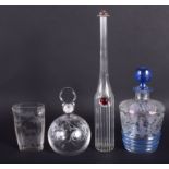 AN ANTIQUE BOHEMIAN CLEAR GLASS VASE together with three bottles. Largest 29 cm high. (4)