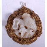 AN EARLY 20TH CENTURY CHINESE WHITE JADE PLAQUE, mounted into a yellow metal filigree frame. 10 cm