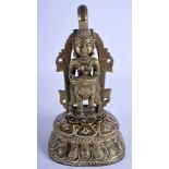 AN 18TH/19TH CENTURY INDIAN BRONZE BUDDHISTIC DEITY modelled upon a lotus capped base. 24 cm x 11 c