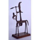AN UNUSUAL AFRICAN IRON SCULPTURE, formed as warrior on horseback. 38 cm x 23 cm.