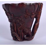 A CHINESE BAMBOO LIBATION CUP, carved with foliage. 9 cm high.