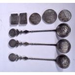 THREE CHINESE SPOONS, stamped “Silver”, together with three coins and two ingots. Spoons 17 cm long