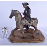 A RARE VICTORIAN CAST IRON FIGURE OF A MILITARY GENTLEMAN modelled upon a horse. Figure 34 cm x 31